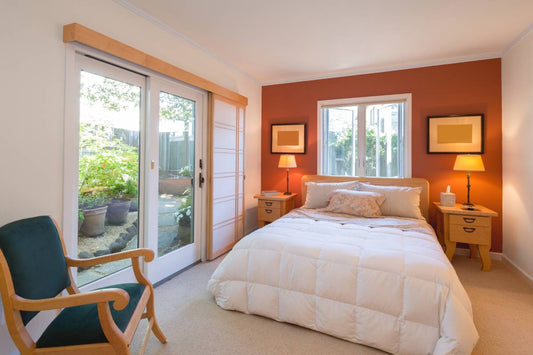 A bedroom with a windowed accent wall near Montclair, NJ