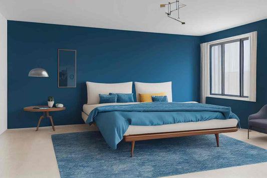 A Mid-Century Modern bedroom design with blue paint and soft window treatments at Red Star Paint near Montclair, New Jersey